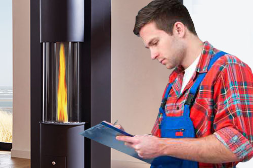 Technician servicing heating boiler
